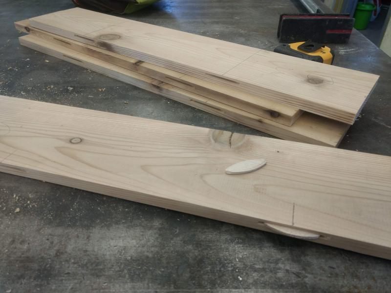 Four cedar boards jointed, planed, trimmed on the table saw and slots cut on the biscuit jointer.  Ready for glue up