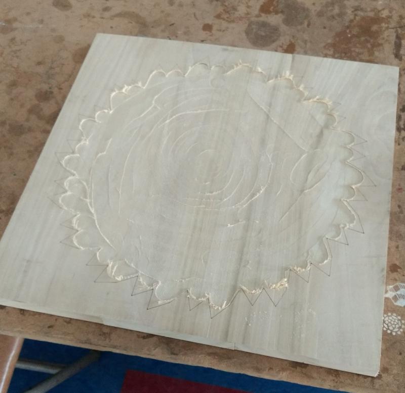 The poplar panel with the outline etched in with the laser.  At this point I'd already hogged out some of the inner material