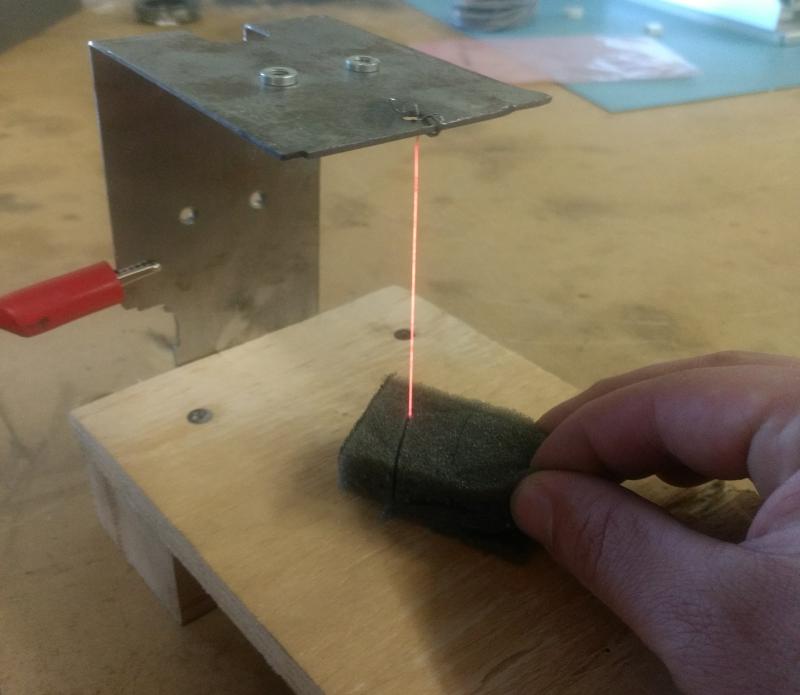 Cutting a piece.  The dimensional control is inarguably poor, but it was sufficient for prototyping